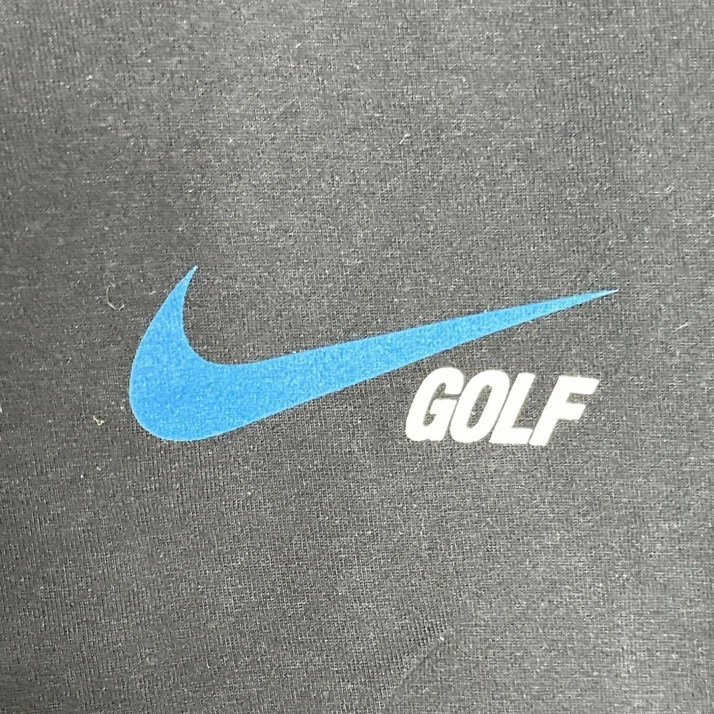 Nike Men's Black Tee with Blue Logo
